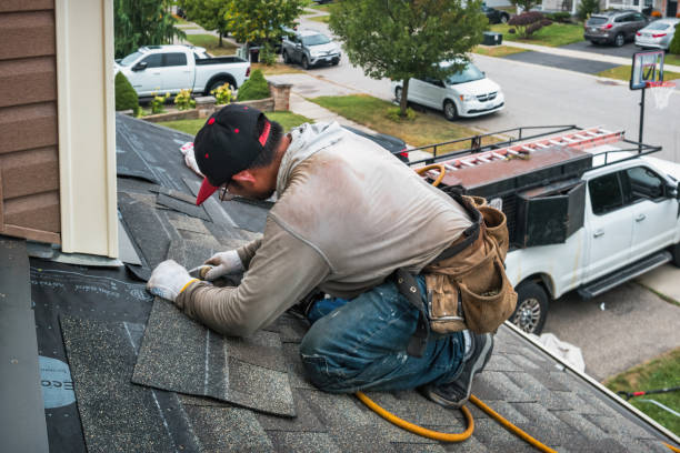 Professional Roof Replacement technician working in Dyersville, IA